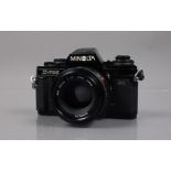 A Minolta X-700 SLR Camera, shutter working, meter responsive, body G, light wear, with MD 50mm f/