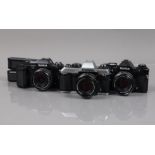 Three Konica SLR Cameras, a Konica FT-1 motor, shutter working, meter responsive, body G-VG, with