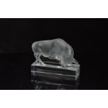 A mid 20th century Lalique clear glass bull, on a rectangular base, 10.5cm in length