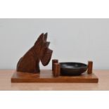 A 20th century Art deco style dog pin tray, the dog a Scottish terrier, with a removable Bakelite