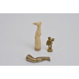 Three 19th century novelty pipe tampers, comprising a bone example in the form of a human leg, 6.5cm