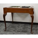 A 1970's Dunhill walnut veneered backgammon table and leatherette counters, removable cover, with