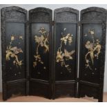 An early 20th century Japanese hardwood screen, comprising of four panels, one side with mother of