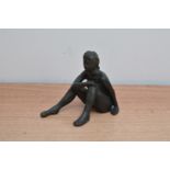 A studio ceramic figure of a nude lady, signed 'Collins' to the underside, 12cm high