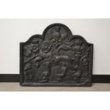 An 18th or 19th century cast iron fireback, with a thistle and prone lion, partial dates to the