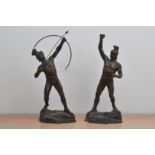 A pair of 20th century spelter figures, Greek men in classic posses, one with a bow and arrow, the