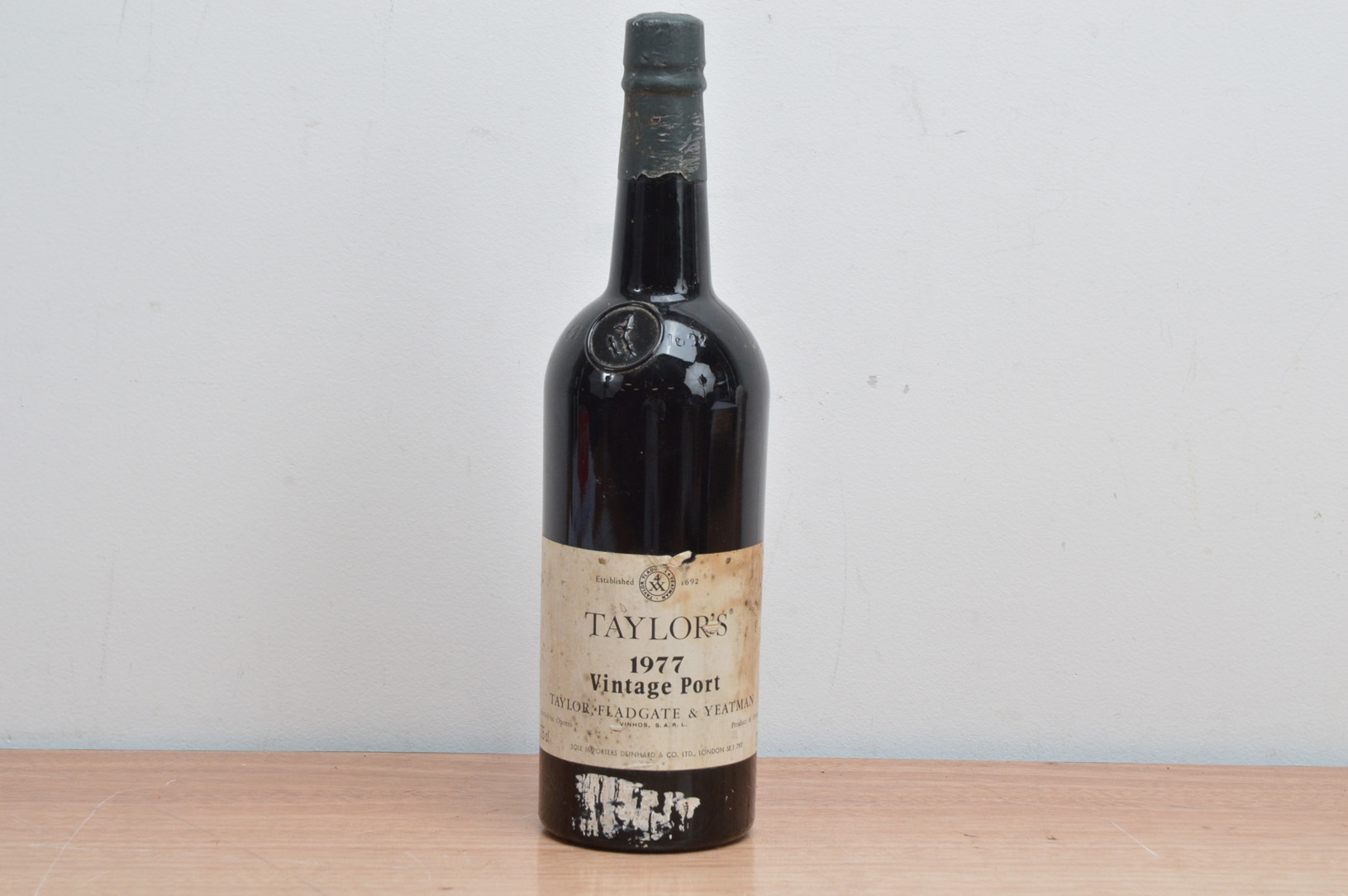 A bottle of Taylor's 1977 Vintage Port, fill level appears good