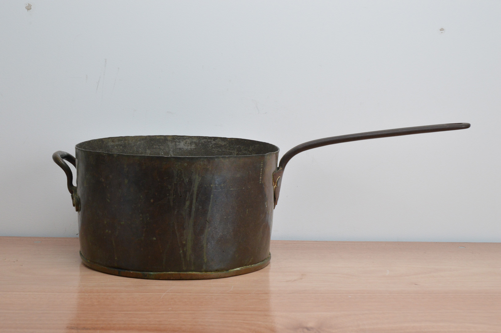 A large 19th century copper and brass pan, embossed with 'Windham Club and Marlborough' 34.5cm