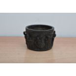 An Chinese 'Tang Dynasty' style bronzed bowl, with assorted characters around the side, 10cm wide