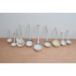 A collection of 19th and 20th century transferware and hand painted ceramic ladles, comprising a