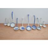 A collection of 19th and 20th century transferware ceramic ladles, six blue and white examples,