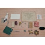 A collection of Sewing accessories, including a crochet book, dated 1852, a leather thimble case,