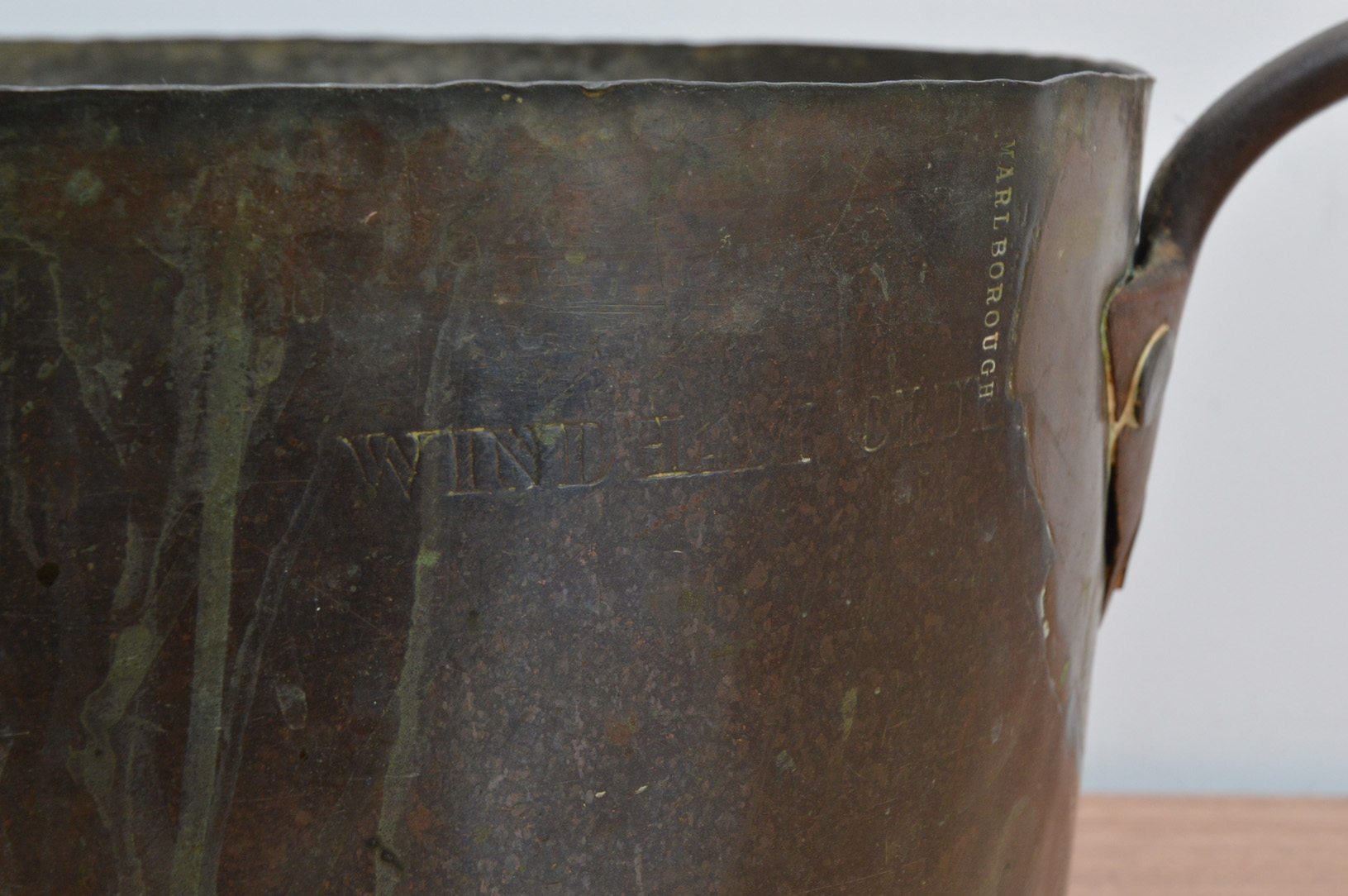 A large 19th century copper and brass pan, embossed with 'Windham Club and Marlborough' 34.5cm - Image 2 of 3