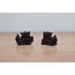 A pair of Chinese early 20th century pressed amber dogs, 6.5cm high (2)