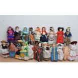 A large collection of Dolls from Dolls of the World, porcelain heads, all with the associated