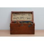 A Victorian electro magnetic 'shocking machine', in a wooden box, inlcusing paper instructions to