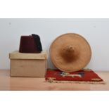 A 20th century Fez, made by Husein Meherally, Bombay, size 6 3/4, in postage box, together with a