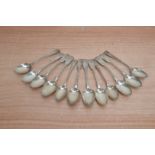 12 Georgian silver dessert Spoons, the majority monogrammed and all hallmarked, total weight 13.36