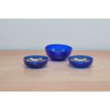 Three Bristol blue glass bowls, two with gild interior design, worn both 9.5cm wide, together with a