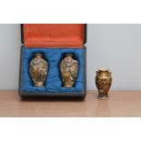 Three early 20th century Japanese satsuma style vases, two in a fitted case both 10cm high with