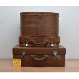 A collection of storage items, comprising an early 20th century suitcase, with partial fitted