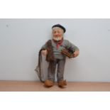 A Ravca stockinette fisherman doll, hand painted face with wooden clogs, 47cm high