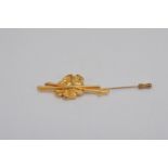 A 'Vintage' French yellow metal lapel pin by Van Cleef & Arpels, marked in relief to the underside
