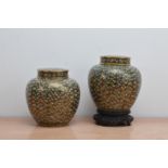 A pair of early 20th century Japanese cloisonne ginger jars and covers, both with colourful floral