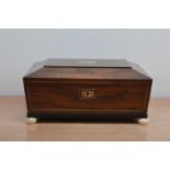 A 19th century Rosewood sewing box, the lid with a mother of pearl rectangular cartouche, ivory