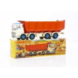 A Dinky Toys 925 Leyland Dump Truck With Tilt Cab, white cab and chassis, orange diecast tipper,