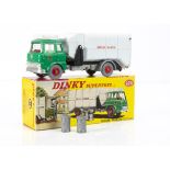 A Dinky Toys 978 Bedford TK Refuse Wagon, bright green cab, red interior and plastic hubs, silver