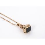 A 9ct gold bloodstone seal and chain, the cushion shaped hardstone on a lyre shaped seal and