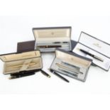 A small group of fountain pens and other pens, including a Parker Slimfold in box, an Onoto The Pen,