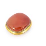 A Chinese carnelian cushion shaped belt buckle, the orange hardstone with in a gilt mount with