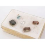 Two loose faceted andalusite gemstones, comprising an oval example 1.2 cts mixed rectangular cut 2.1