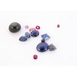A small collection of sapphires and rubies, including, a star sapphire, an oval cabochon blue