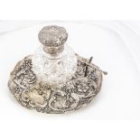 A Victorian silver and cut glass presentation inkwell by Charles Boynton, 18.5cm diameter, the