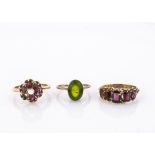 Three gem set rings, including a garnet cluster ring size L, with one setting vacant and a paste