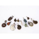 A small collection of Ammonite silver and white metal set jewels, including a nautilus pendant, a