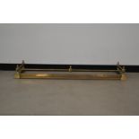 A Victorian brass and cast metal extending fender, 16cm H x 133cm W x 36cm D