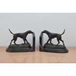 A pair of bronzed cast metal dogs, by Mene, on marble stands in the form of book ends, both with