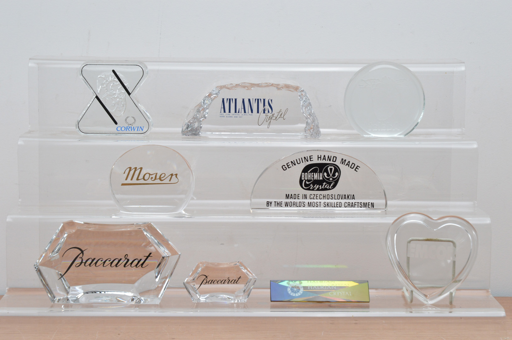 Nine crystal advertising plaques, including Baccarat, Corwin, Atlantis, Mosers, and others (9)