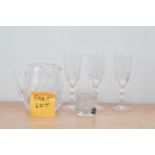 A very large collection of cut glass drinking items, including champagne flutes, tumblers, sherry