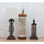 A pair of hardwood Chinese long life and happiness table lamps, one with a shade 38cm high, together