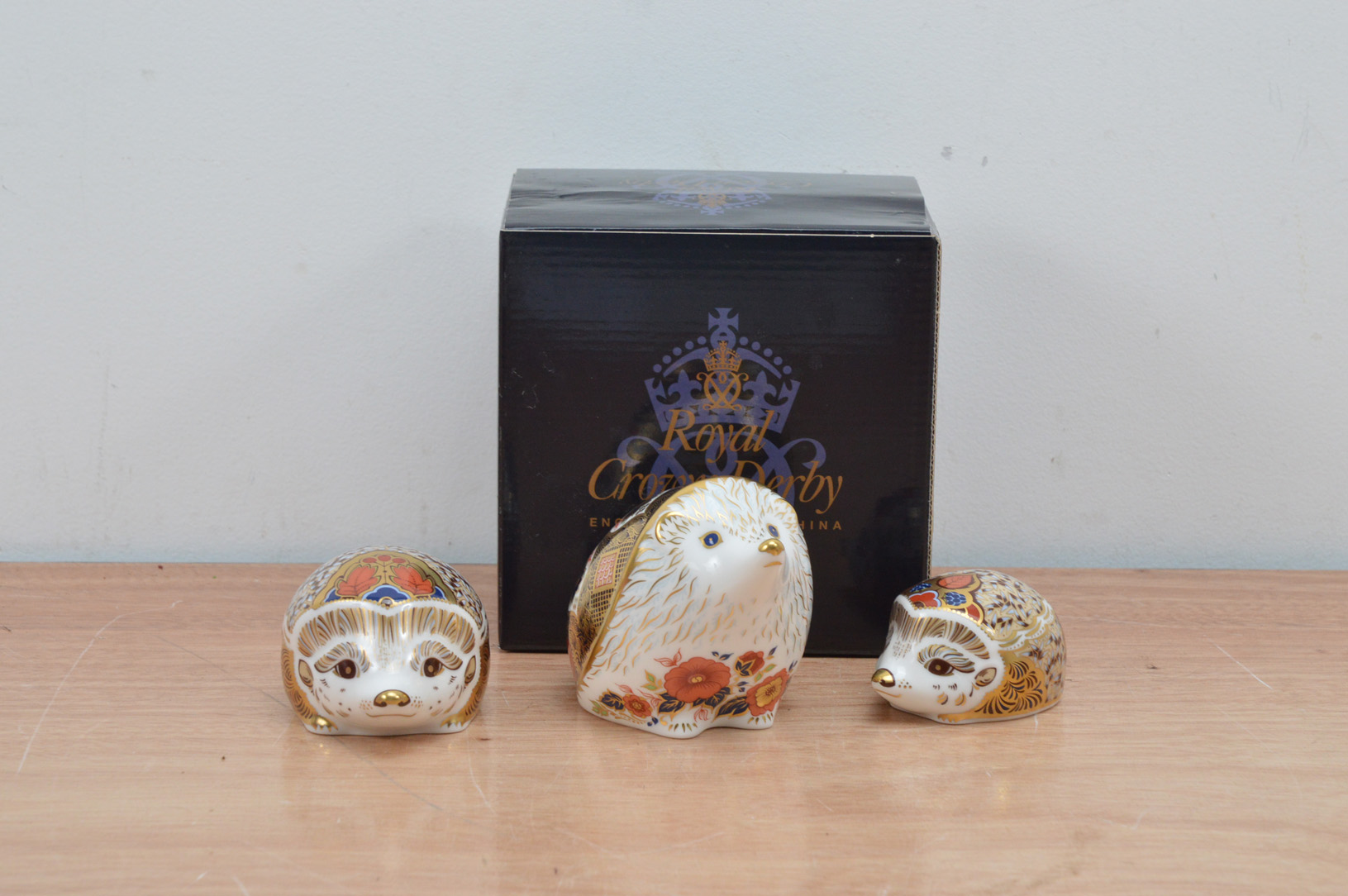 Three Royal Crown Derby bone china paperweights, comprising the Old Imari Hedgehog with a retail