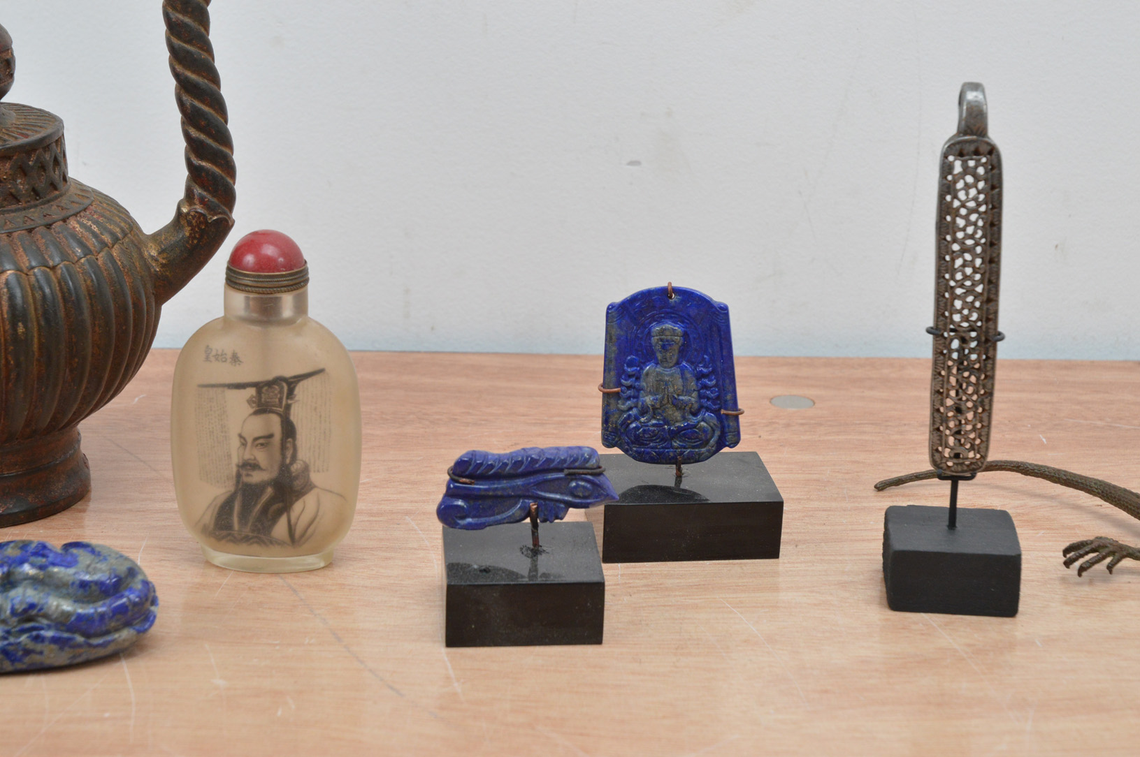 A collection of far eastern works of art, comprising a gilt token 9cm high, carved pieces of lapis - Image 2 of 3