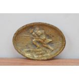 A French World War I brass dish, depicting a running soldier, with writing crudely engraved 14.5cm