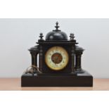 An early 20th century slate mantle clock, the dial with Arabic numerals, untested, in neoclassical