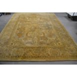 A large 20th century Indian carpet, hand woven, ivory colour with symmetrical design 242cm x 337cm