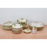A large collection of Minto ceramic table ware items, the majority with heightened gilt and